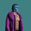 Stylish man with mask dressed in purple fur coat Royalty Free Stock Photo