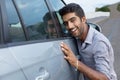 Stylish man obsessed with new car safety