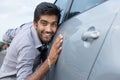 Stylish man obsessed with new car safety