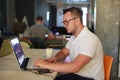 Stylish man using laptop in office Royalty Free Stock Photo