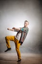 Stylish man expressing riding a bike in pantomimes Royalty Free Stock Photo