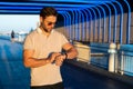 Stylish man wearing sunglasses and shirt. Handsome man outdoors portrait. Portrait of stylish male model outdoor