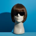 Stylish Mannequin With Sunglasses On Blue Background