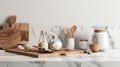 Stylish marble tabletop on wooden platform with copyspace for your logo at blurry kitchen utensils and dishes