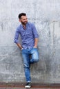 Stylish mature man standing against wall Royalty Free Stock Photo