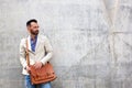 Stylish mature man standing against wall Royalty Free Stock Photo