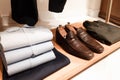 Stylish men`s clothing and shoes in a clothing store Royalty Free Stock Photo