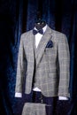 Stylish men`s gray check suit on a mannequin or dummy. Men`s Clothing. Clothing store. Shopping in boutiques Royalty Free Stock Photo