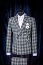 Stylish men`s gray check suit on a mannequin or dummy. Men`s Clothing. Clothing store. Shopping in boutiques Royalty Free Stock Photo