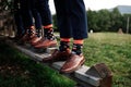 Stylish men`s socks. Stylish suitcase, men`s legs, multicolored socks and new shoes. Concept of style, fashion Royalty Free Stock Photo