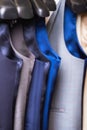 Stylish men`s vest close up. Male svest hanging in a row. Men`s Clothing, shopping in boutiques. vest and suits in a Royalty Free Stock Photo