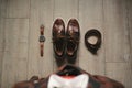 Stylish men& x27;s plaid suit and brown shoes, watch and groom& x27;s belt.