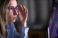 Stylish mid-aged woman looking concerned while remote working from home Royalty Free Stock Photo