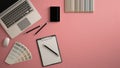 Stylish minimal office table desk. Workspace with laptop, notebook, pencils and sample color palette on pastel pink background. Fl