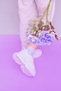 Stylish minimal Sneakers and flowers.  Aesthetic pastel monochrome design. Ideal for bloggers, websites, magazines, business Royalty Free Stock Photo