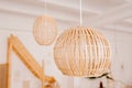 Stylish minimalist bamboo chandeliers on the ceiling Royalty Free Stock Photo