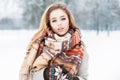 Stylish model girl in fashionable clothes with a scarf standing