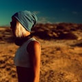 Stylish model sunset light in the desert Royalty Free Stock Photo