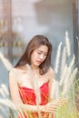 Stylish model wearing fashionable red lace dress, on sunny day. Spring, summer.selective focus.