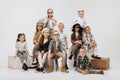 Group of beautiful kids, little girls and boys in modern outfits posing on grey studio background. Beauty, kids fashion Royalty Free Stock Photo