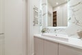Stylish and modern bathroom interior with a large mirror Royalty Free Stock Photo