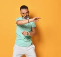 Stylish modern and cool funky trendy gray-haired hipster guy dancing and having fun Royalty Free Stock Photo