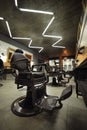stylish modern empty barbershop interior with chairs, mirrors and lamps. Barbershop armchair, salon, barber shop for men