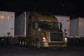Stylish modern golden semi truck and trailers on overnight parking