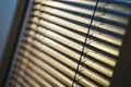Stylish modern horizontal and vertical blinds made of fabric and metal on the windows for protection from sunlight. Royalty Free Stock Photo