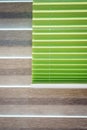 Stylish modern horizontal and vertical blinds made of fabric and metal on the windows for protection from sunlight. Royalty Free Stock Photo