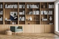 Stylish modern interior of contemporary library with comfortable armchair. Book with bookshelf. Wooden parquet floor