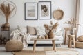Stylish and modern living room interior in boho style with mockup photo frames Royalty Free Stock Photo