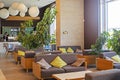 stylish modern office interior with green plants in the lobby with a bar