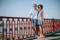 stylish multiethnic couple in sunglasses standing