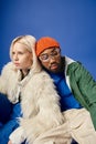 stylish multiethnic couple in winter attire
