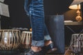 Stylish musician playing the Cajon drums. Royalty Free Stock Photo