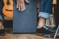 Stylish musician playing the Cajon drums. Royalty Free Stock Photo