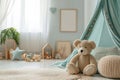 Stylish newborn baby room with furniture, mock up poster, natural toys, hanging green canopy, accessories, teddy bears Royalty Free Stock Photo