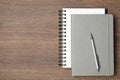 Stylish notebooks and pen on wooden table, top view. Space for text Royalty Free Stock Photo