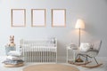 Stylish nursery interior with empty posters on wall. Mockup for design Royalty Free Stock Photo