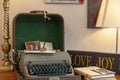 A stylish office decor with a green and gray antique Remington letter ritter model typewritter