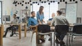 In the Stylish Open Space Office: Diverse Group of Enthusiastic Business Marketing Professionals U Royalty Free Stock Photo