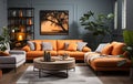 Stylish orange colour living room with design furniture, plants, book stand and wooden desk. Modern decor of bright room