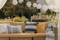 Stylish outdoor living room on the terrace of elegant house, real photo Royalty Free Stock Photo