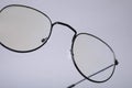 Stylish pair of glasses on light grey background, closeup