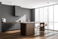 Stylish panoramic grey kitchen with wood materials