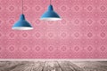 Pendant lamps hanging near pink wall in room Royalty Free Stock Photo