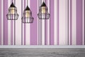 Pendant lamps hanging near striped wall in room Royalty Free Stock Photo