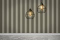 Pendant lamps hanging near striped wall in room Royalty Free Stock Photo