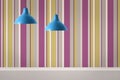 Pendant lamps hanging near striped wall in room Royalty Free Stock Photo